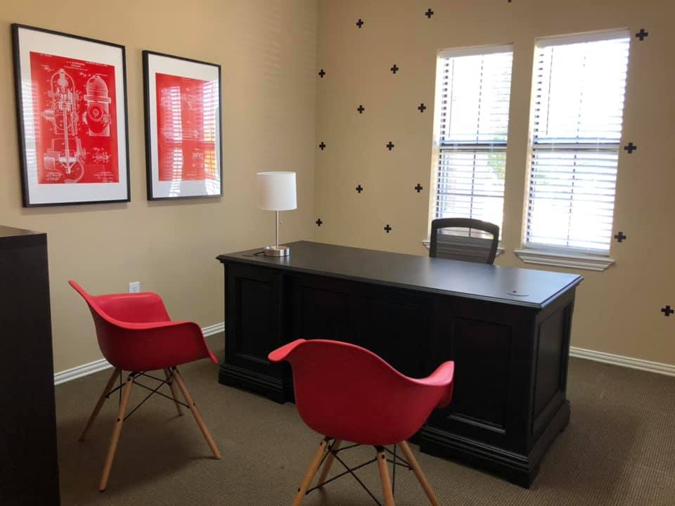 Picture chairs and desk at of office at Red Ladder Roofing & Construction